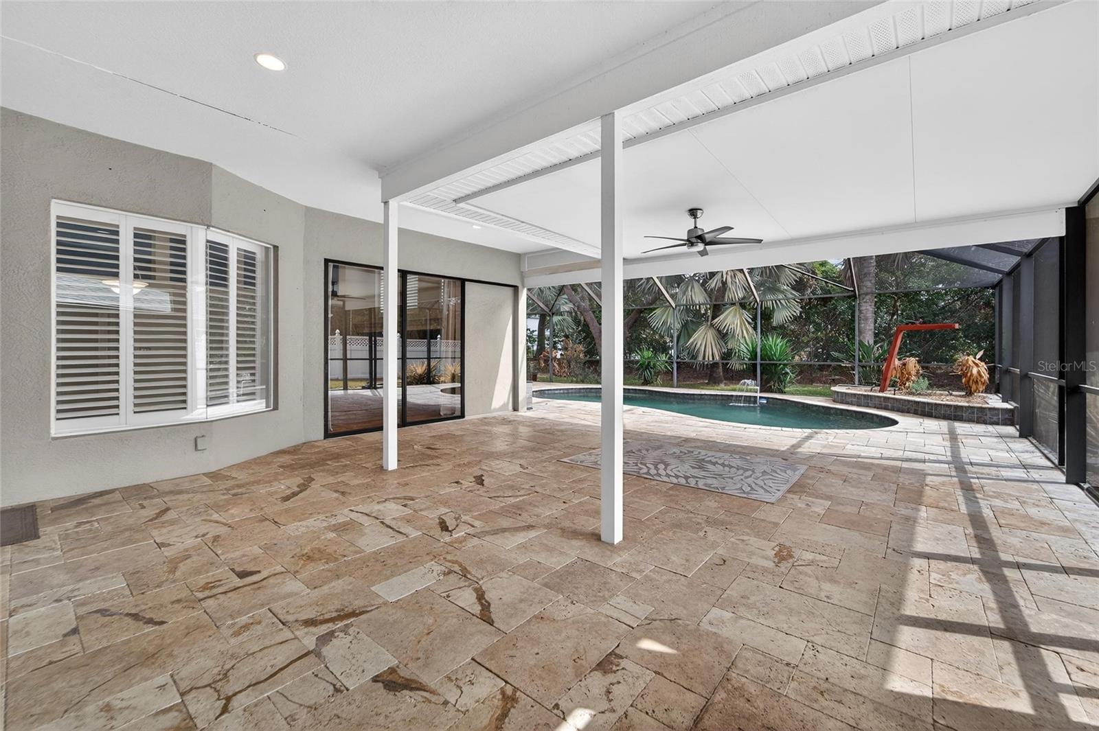 Entire lanai has travertine flooring