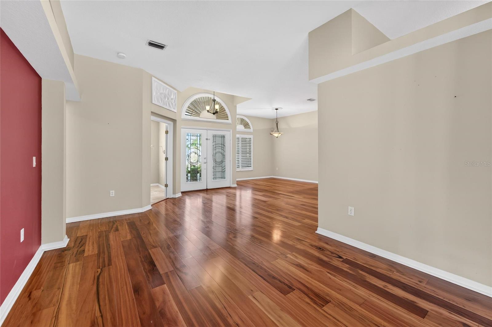 Wood floors adorn & flow elegantly through the open floor plan