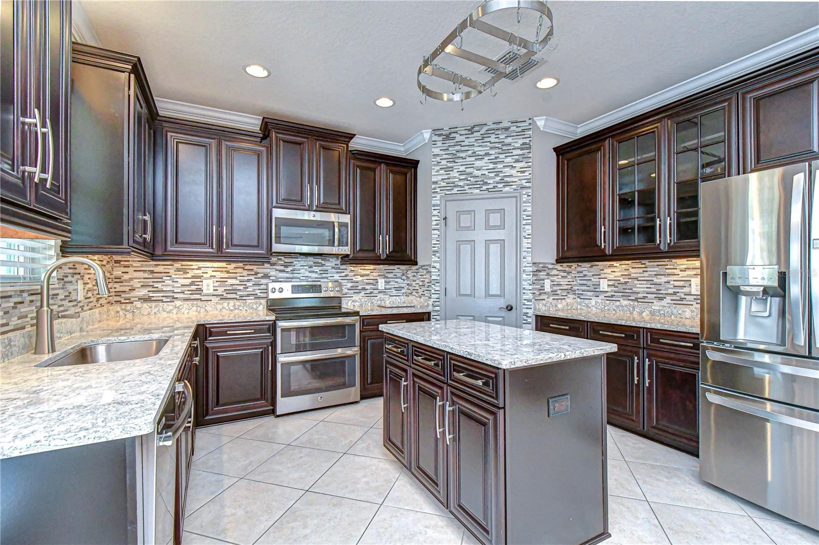 42" dark cabinets compliment the quartz countertops!