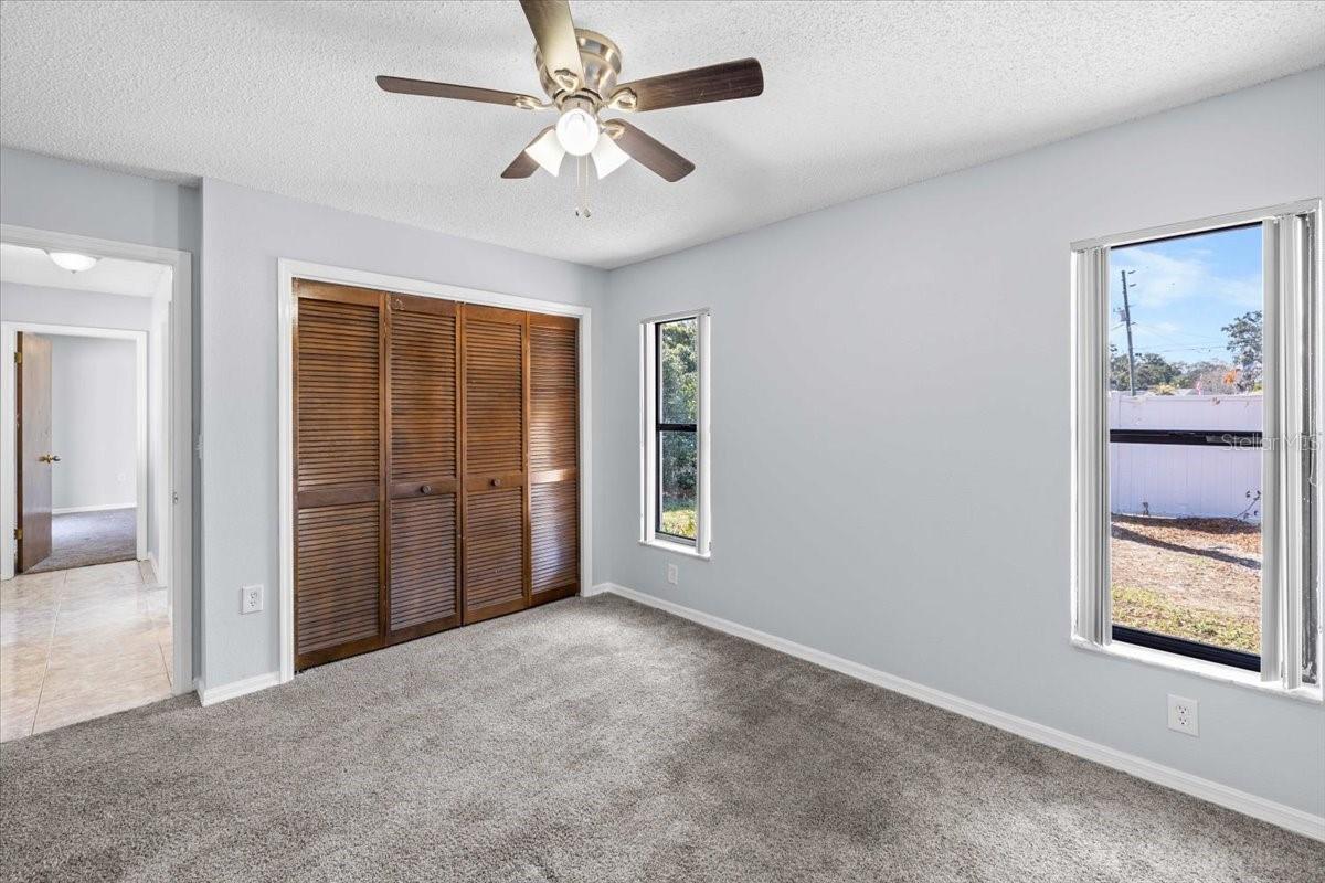 Guest Bedroom 2 with slider to pool