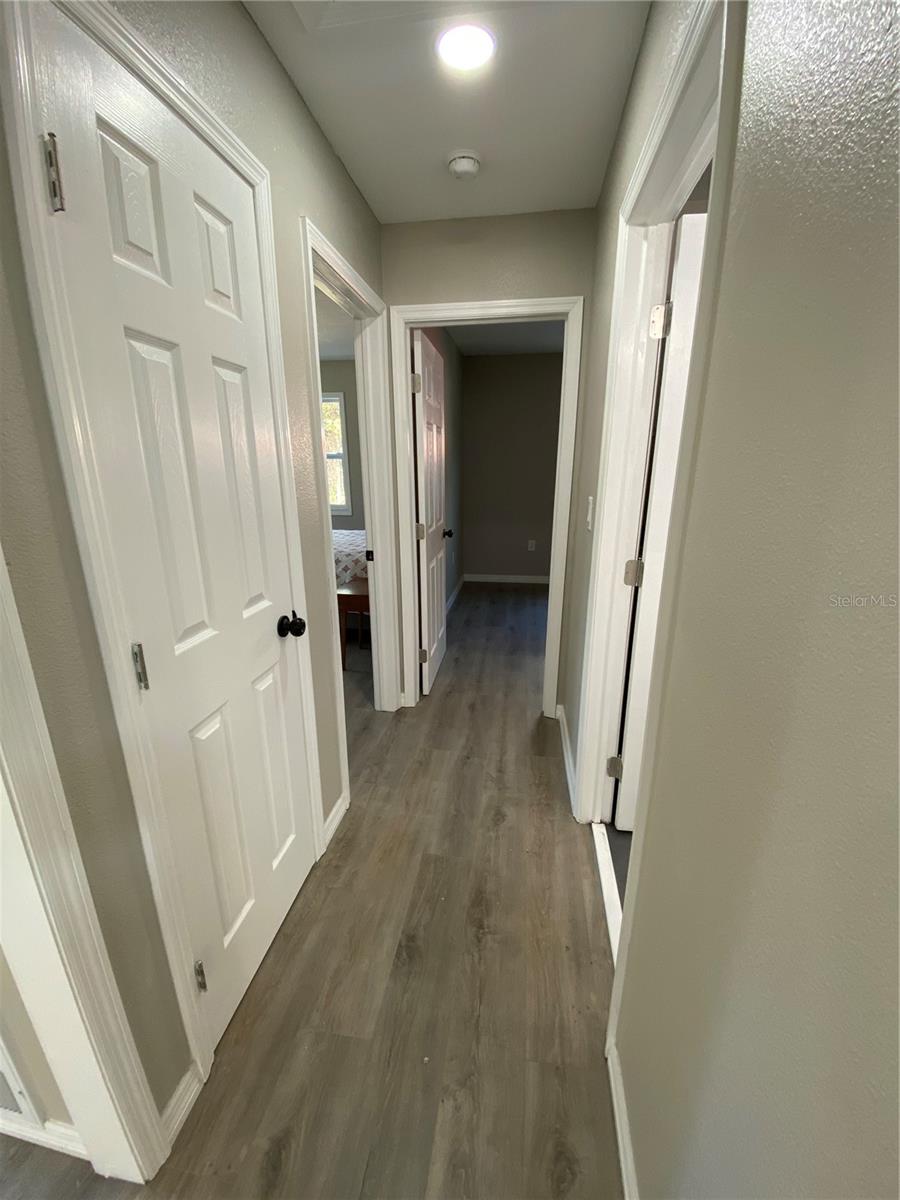 Hallway to bedrooms and bathroom