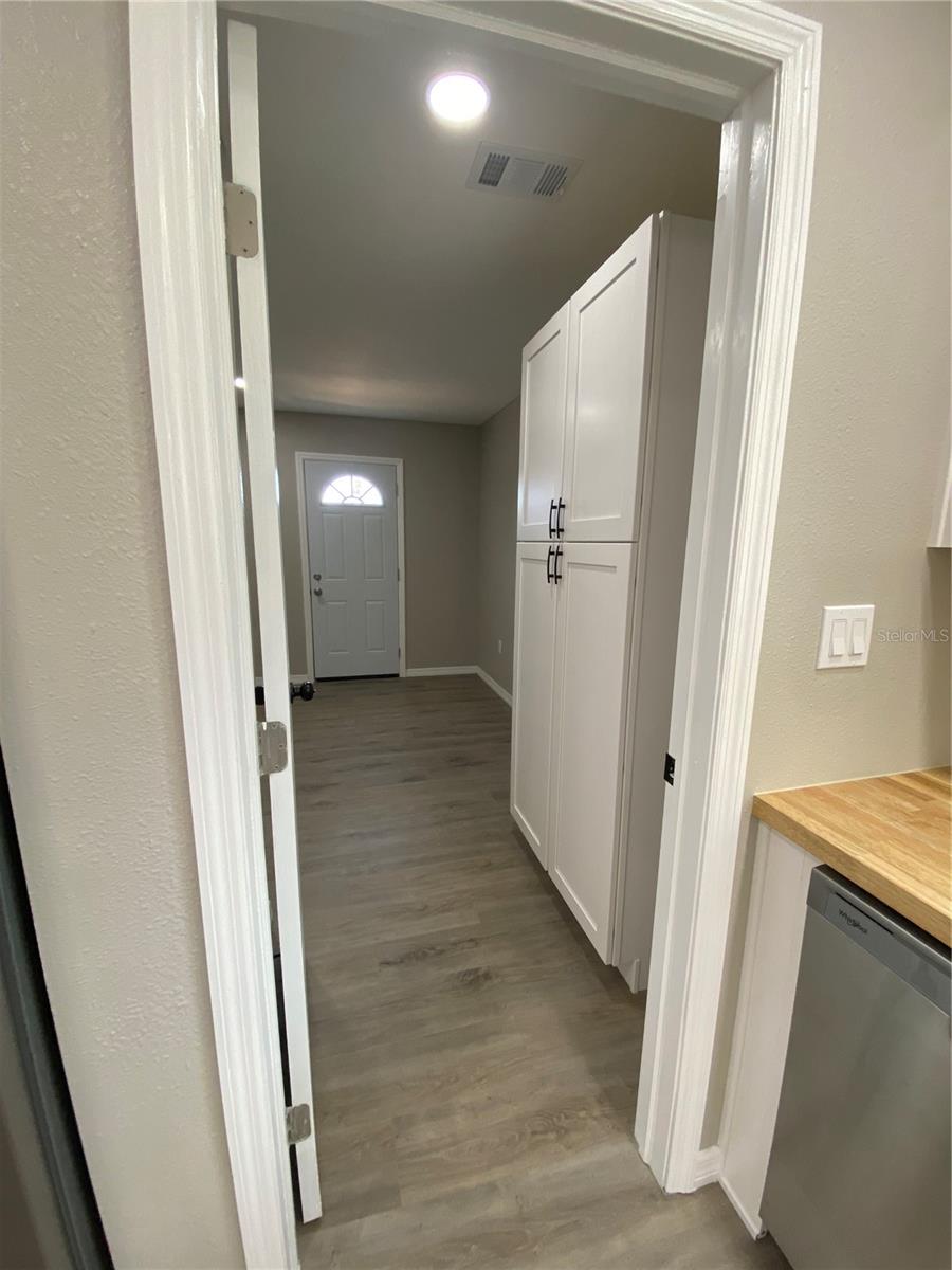 Laundry room with pantry
