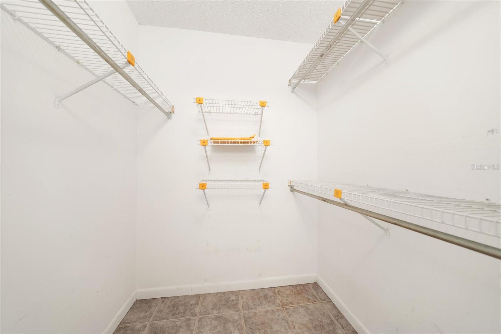 Primary Bedroom walk-in closet