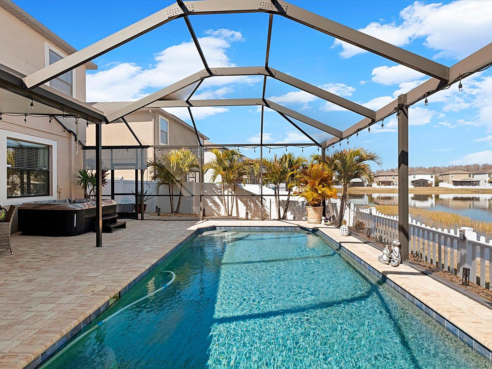 Covered Lanai overlooking pool and pond
