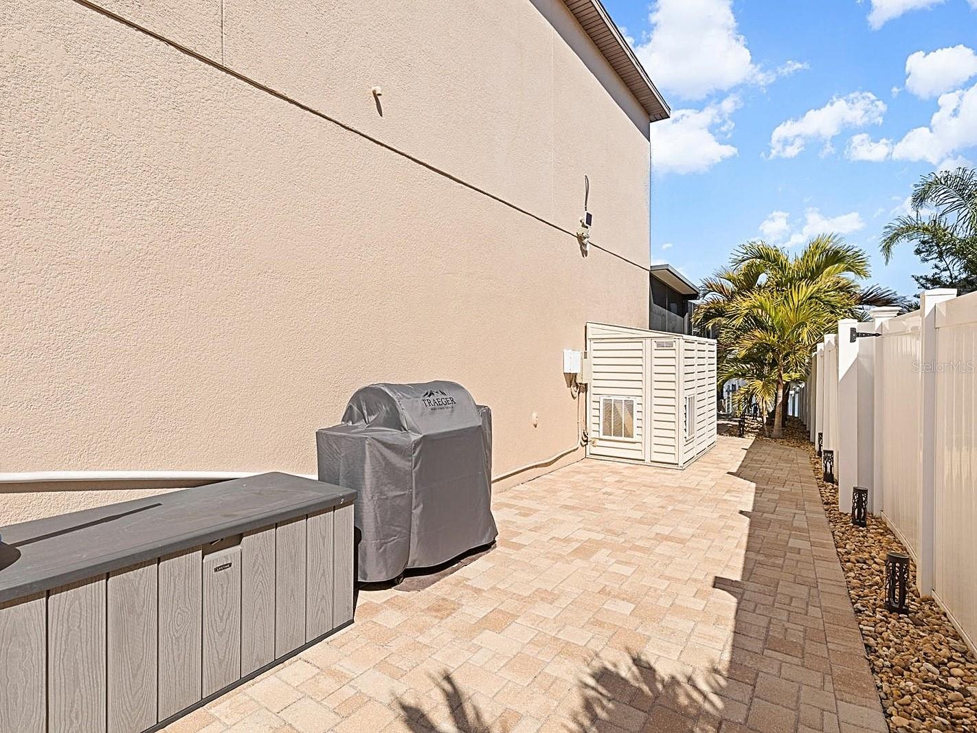 Low-maintenance paved side-yard area