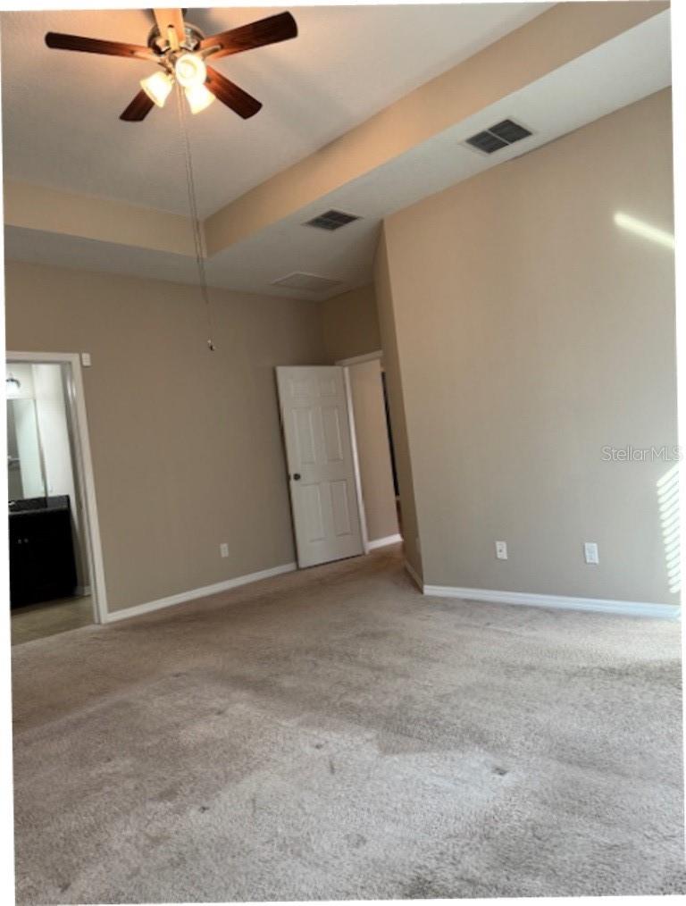 Master bedroom looking towards door and bath