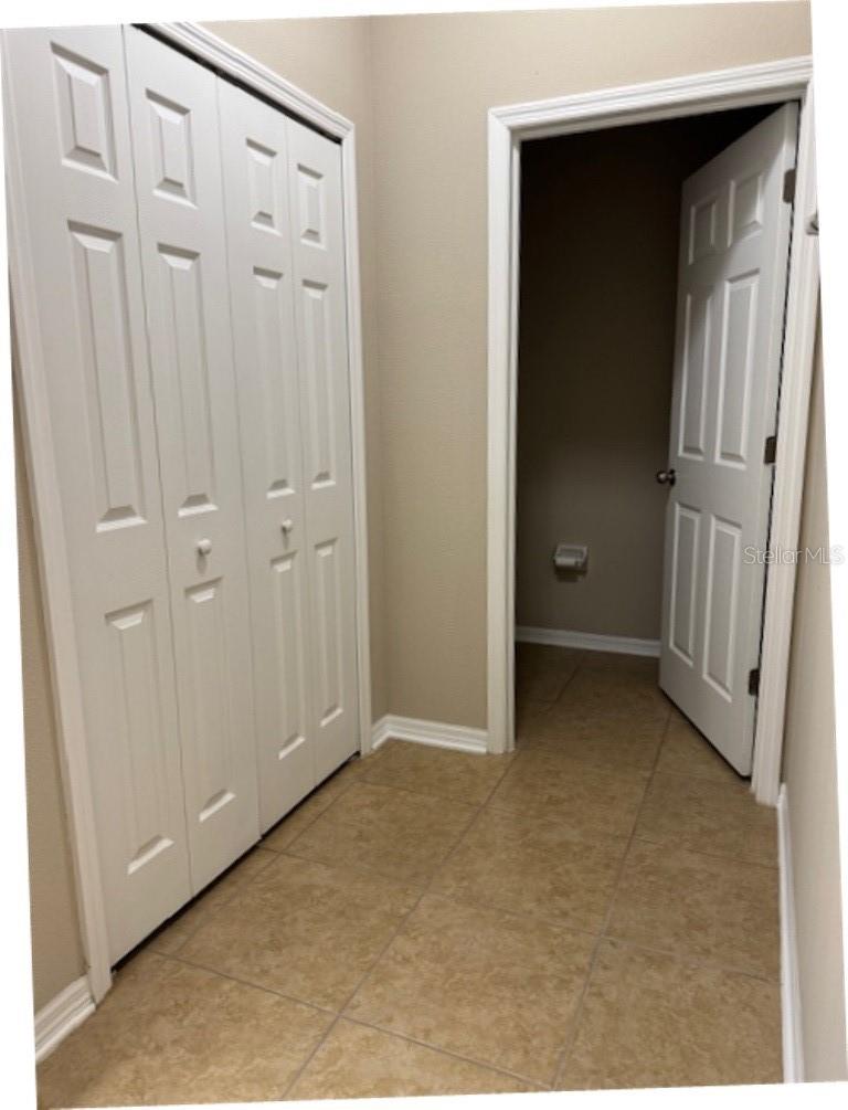 Master linen closet and toilet area
