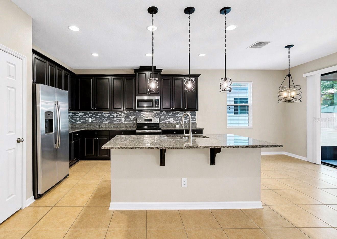 Frontal view of kitchen lots of cabinets