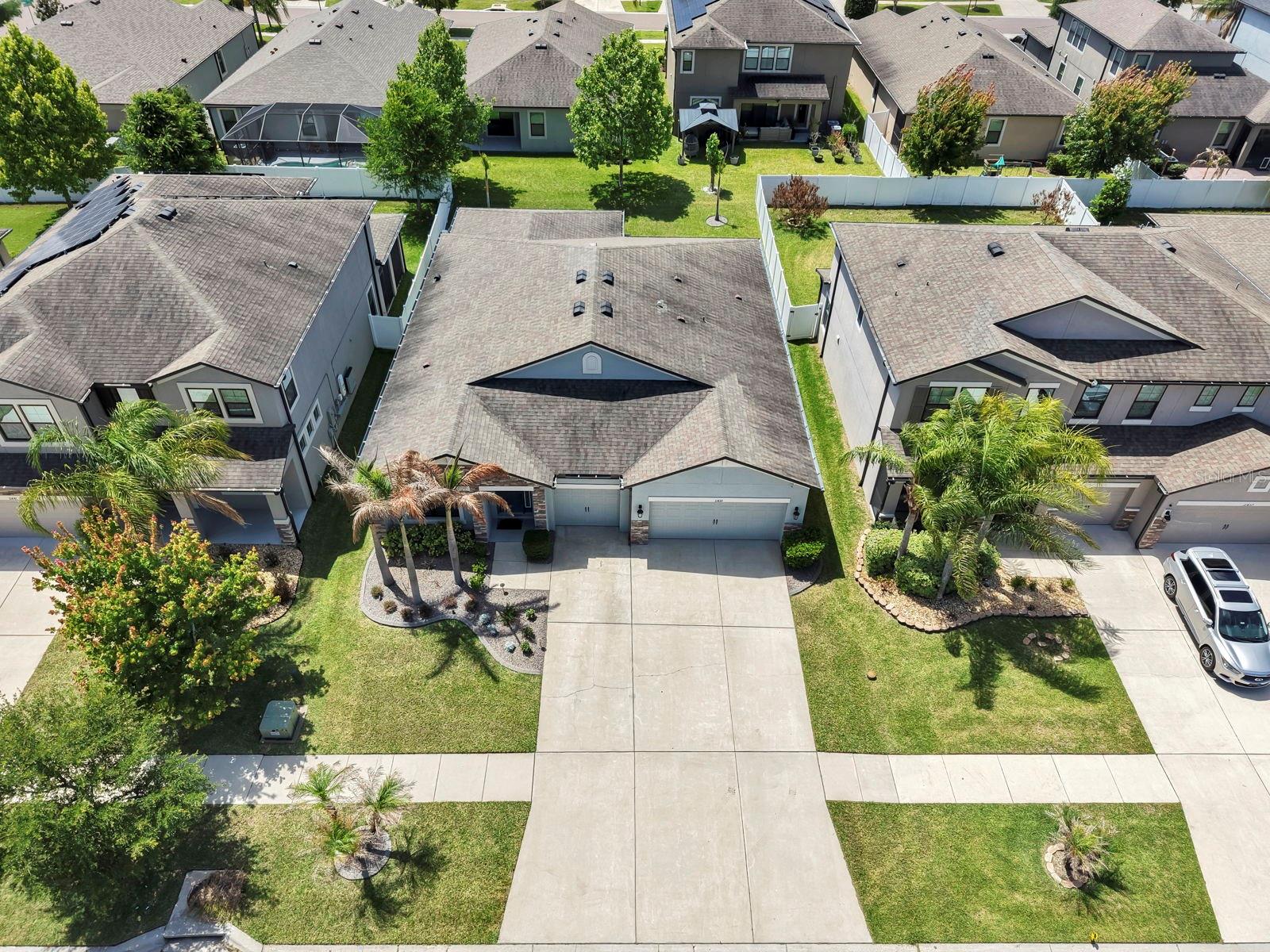 Aerial of house house sits in the middle