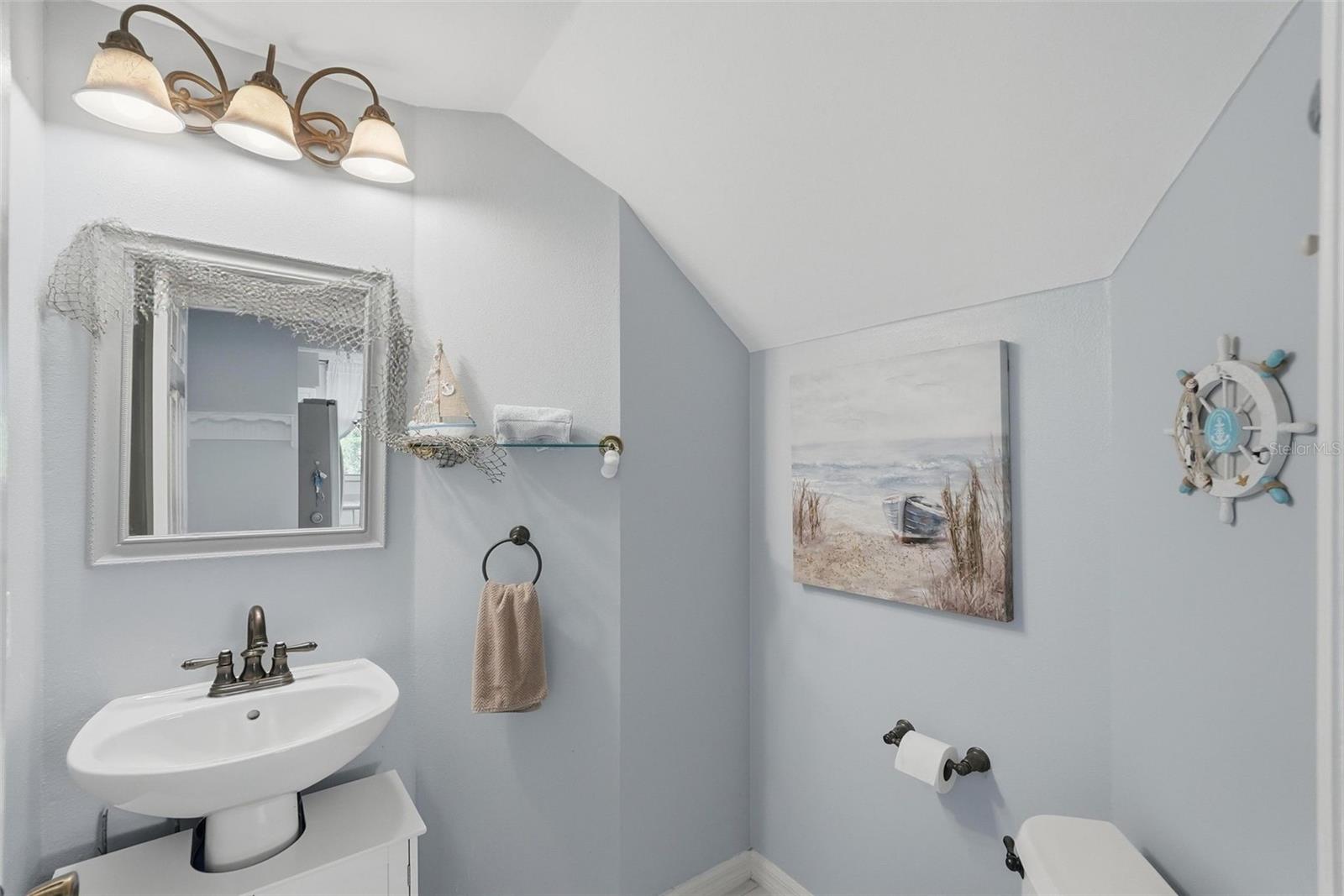 Half bath downstairs by kitchen and garage entrance