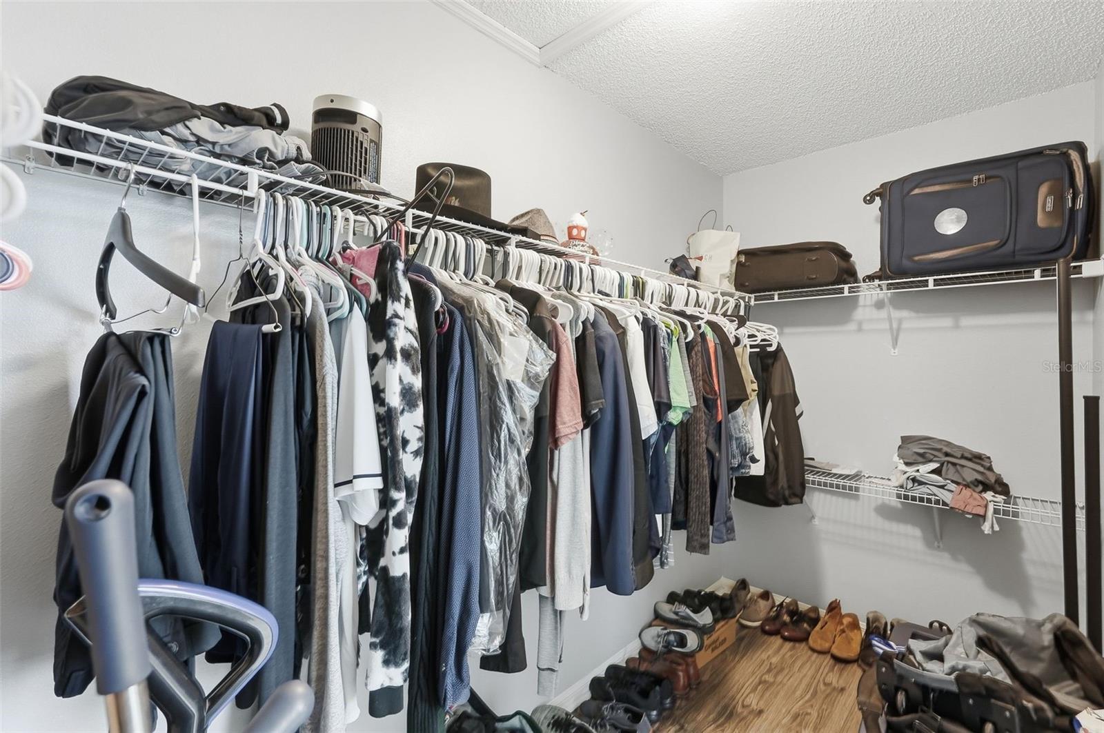 Primary bedroom walk in closet