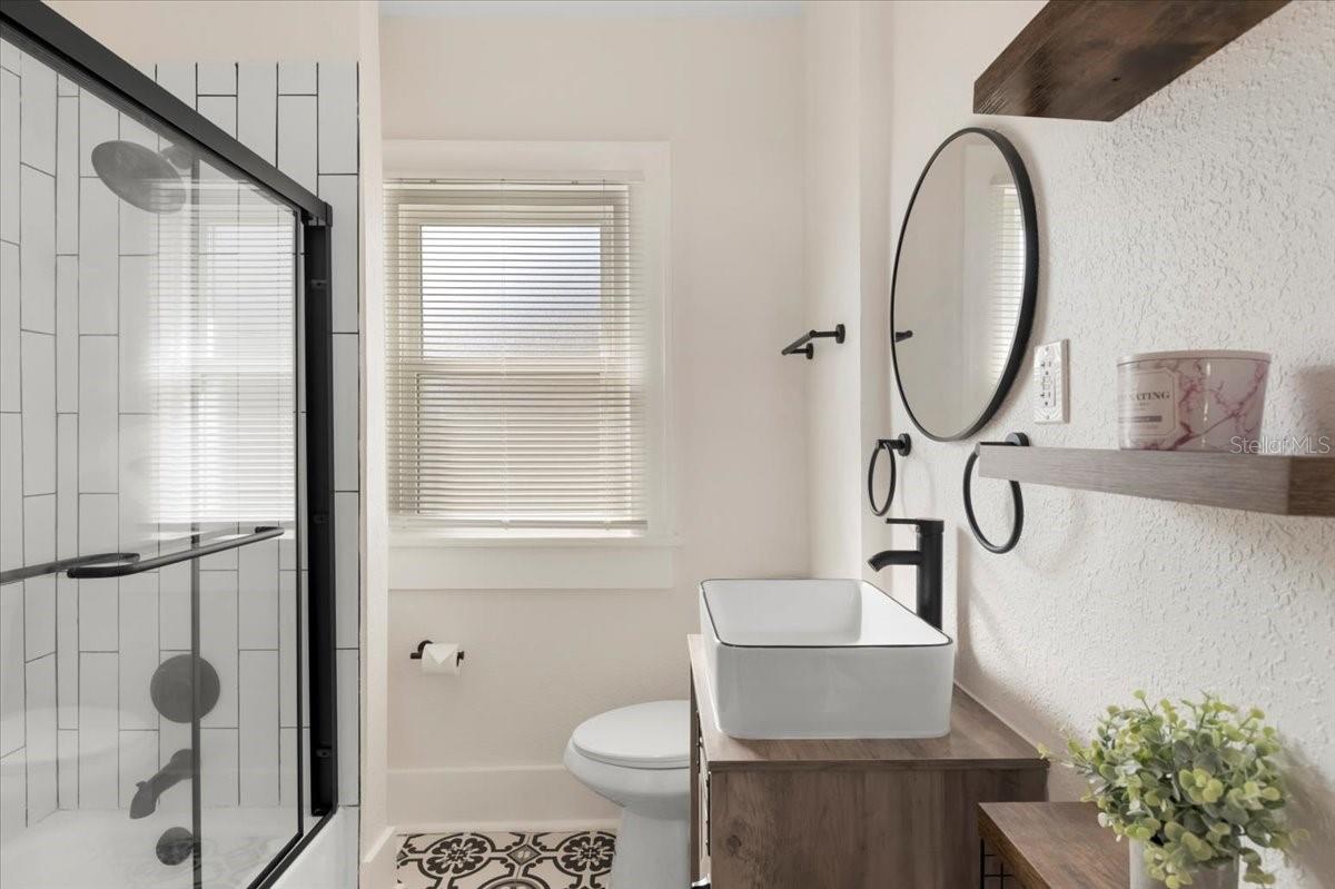 spacious bathroom with tub shower combo