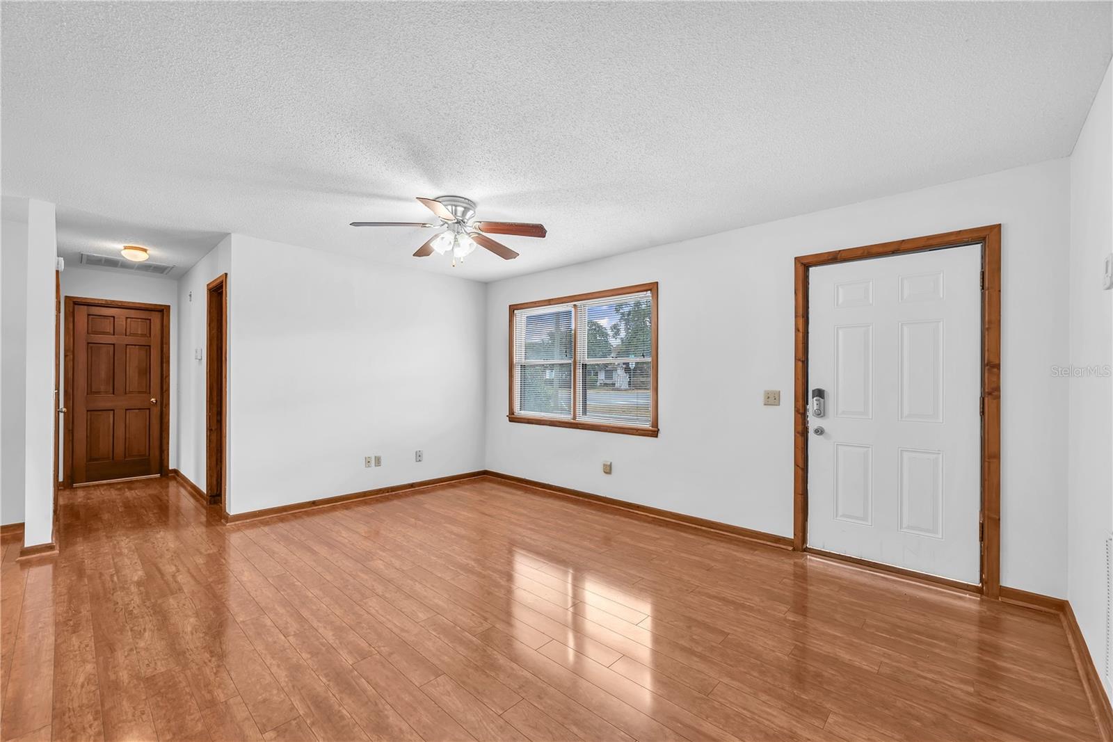 Step inside to find beautiful wood floors flowing throughout the main living areas and bedrooms.