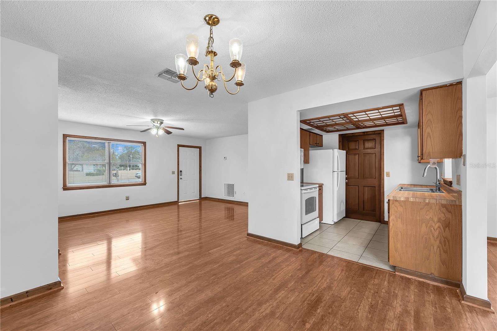 Dining room, living room and kitchen with access to the 1 car garage.