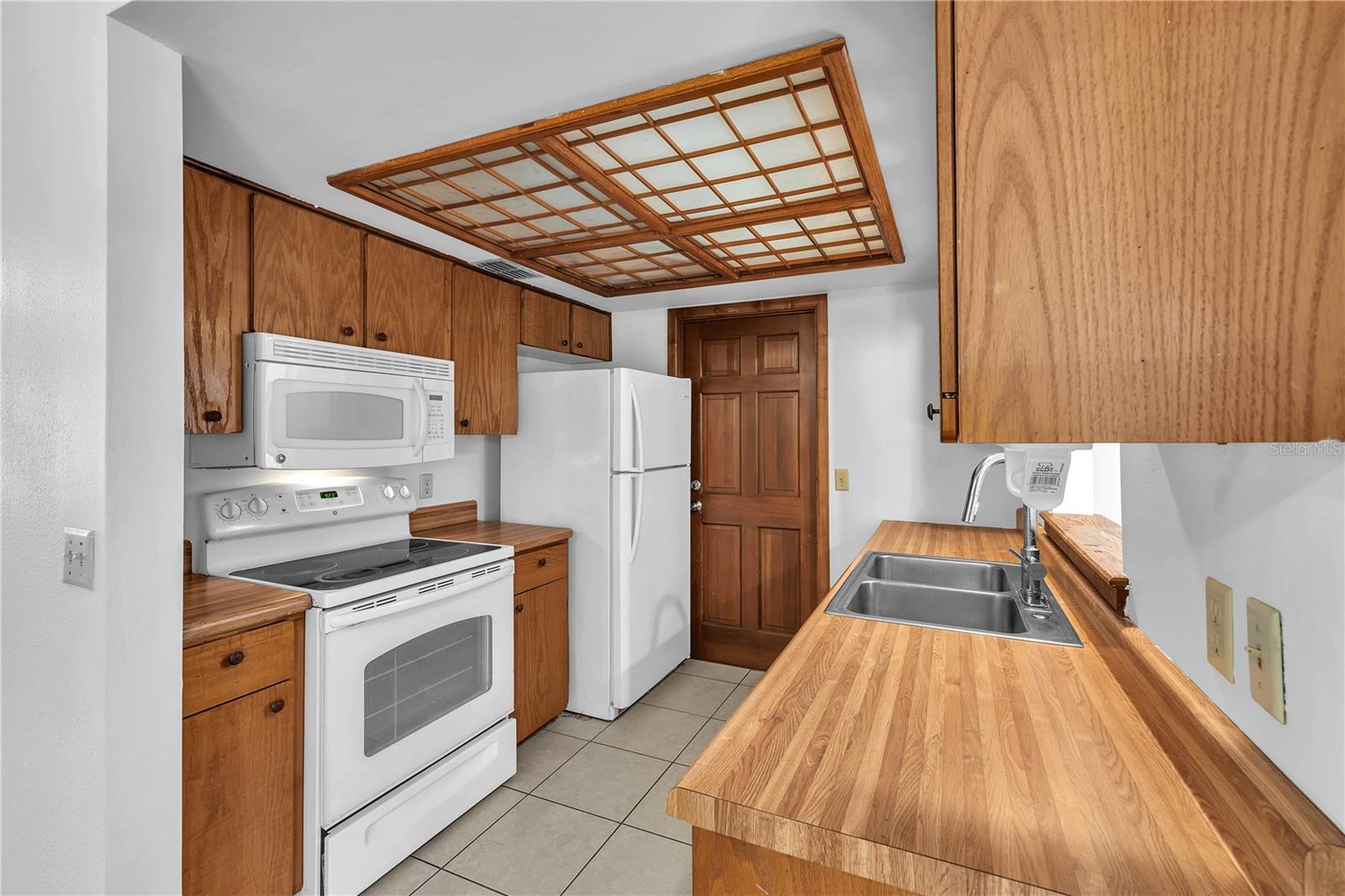 The kitchen has great functionality and plenty of cabinet storage.