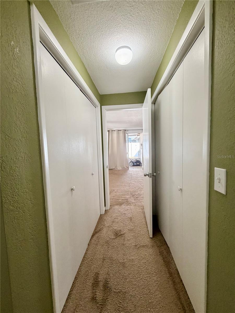 Dual closets in Primary bedroom looking out to family room.