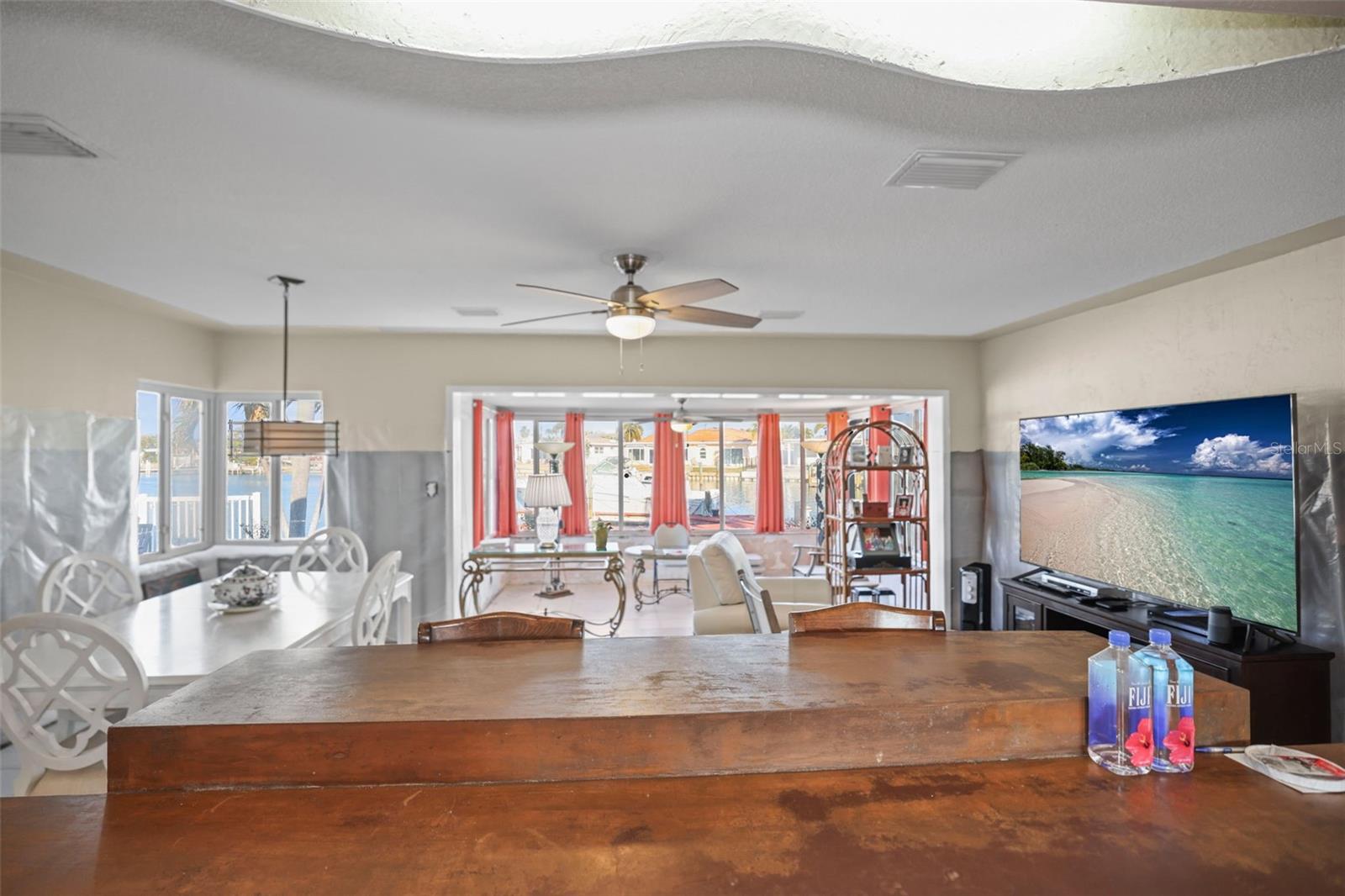 OPEN LIVING/DINING ROOM VIEW TO THE SUNROOM