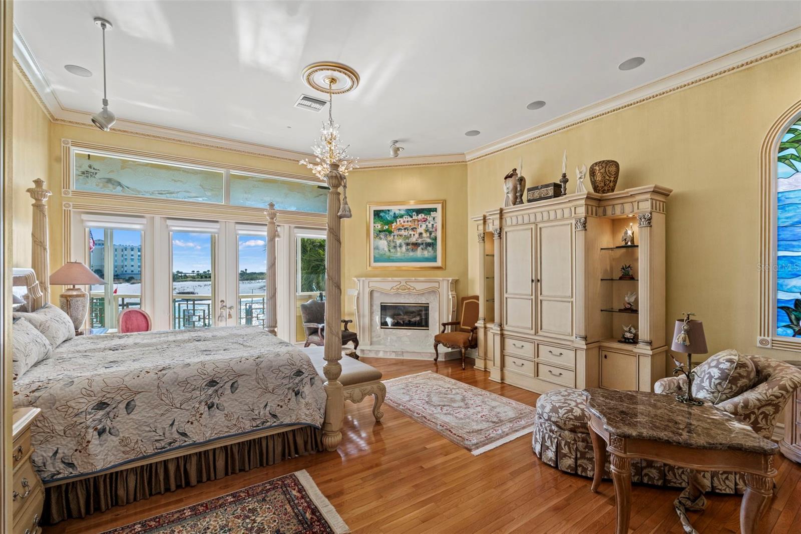 Master Suite with Wood Floors and Fireplace