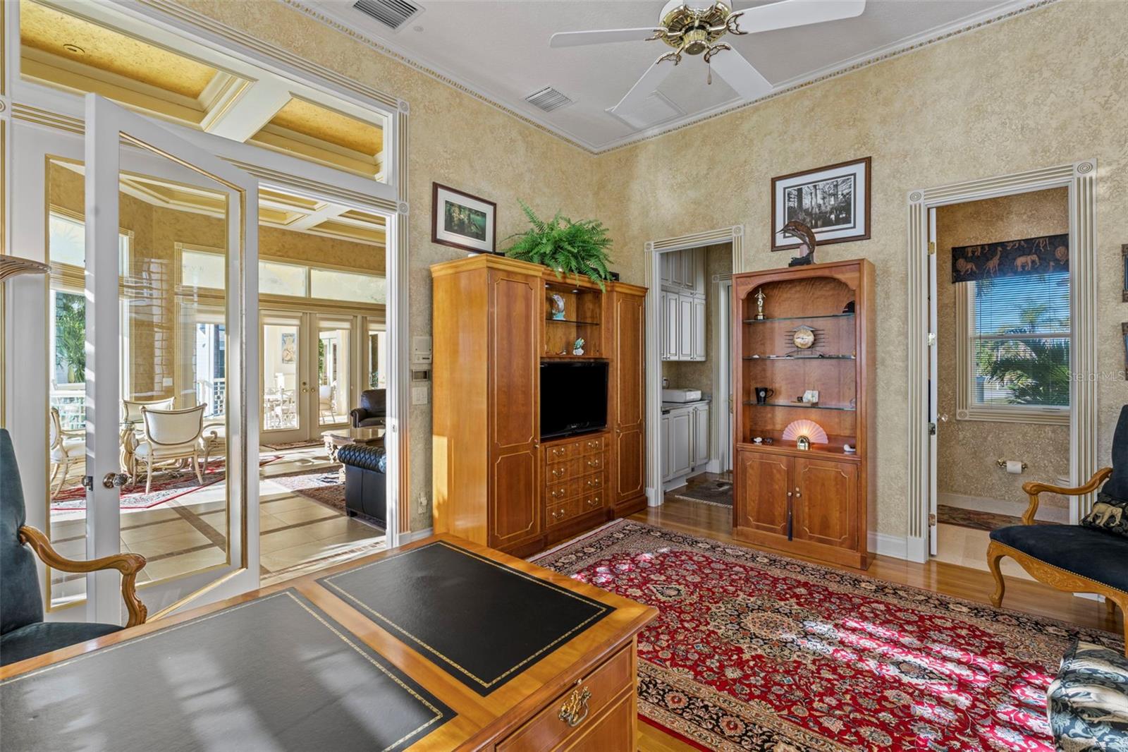 The Fifth Bedroom has access to the Gathering Room, an ensuite Bath with shower, and a walk-through closet that leads to the Grilling Porch.