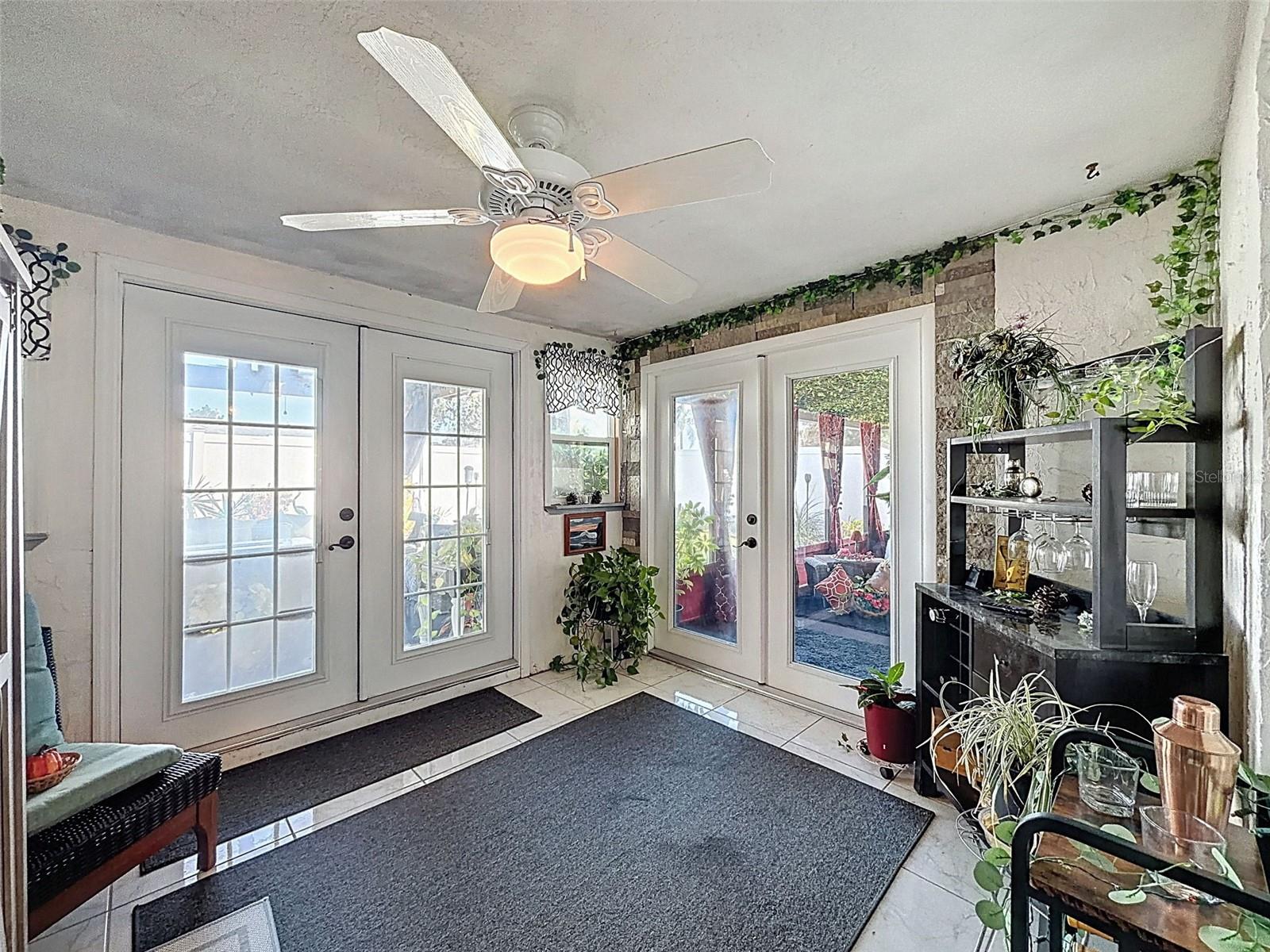 Bonus area leads out to the Screened porch and gorgeous backyard entertainment area