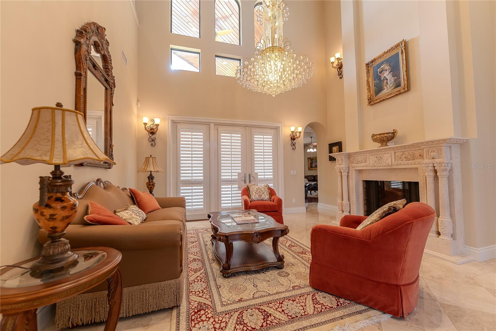 Grand front living area with gas fireplace creating a welcoming focal point.