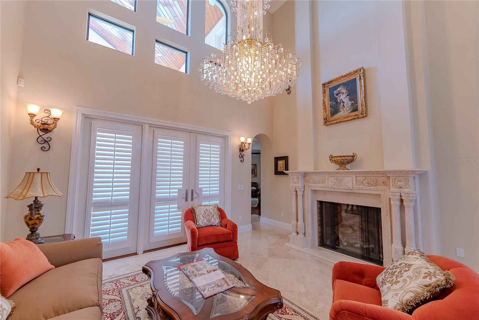 Dramatic ceiling height and natural light welcome you inside.