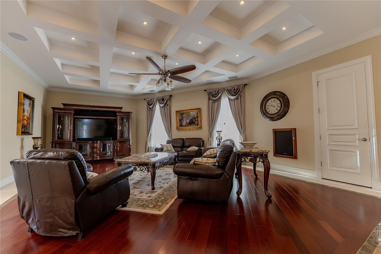 Coffered ceilings and refined finishes create a grand yet inviting gathering space.