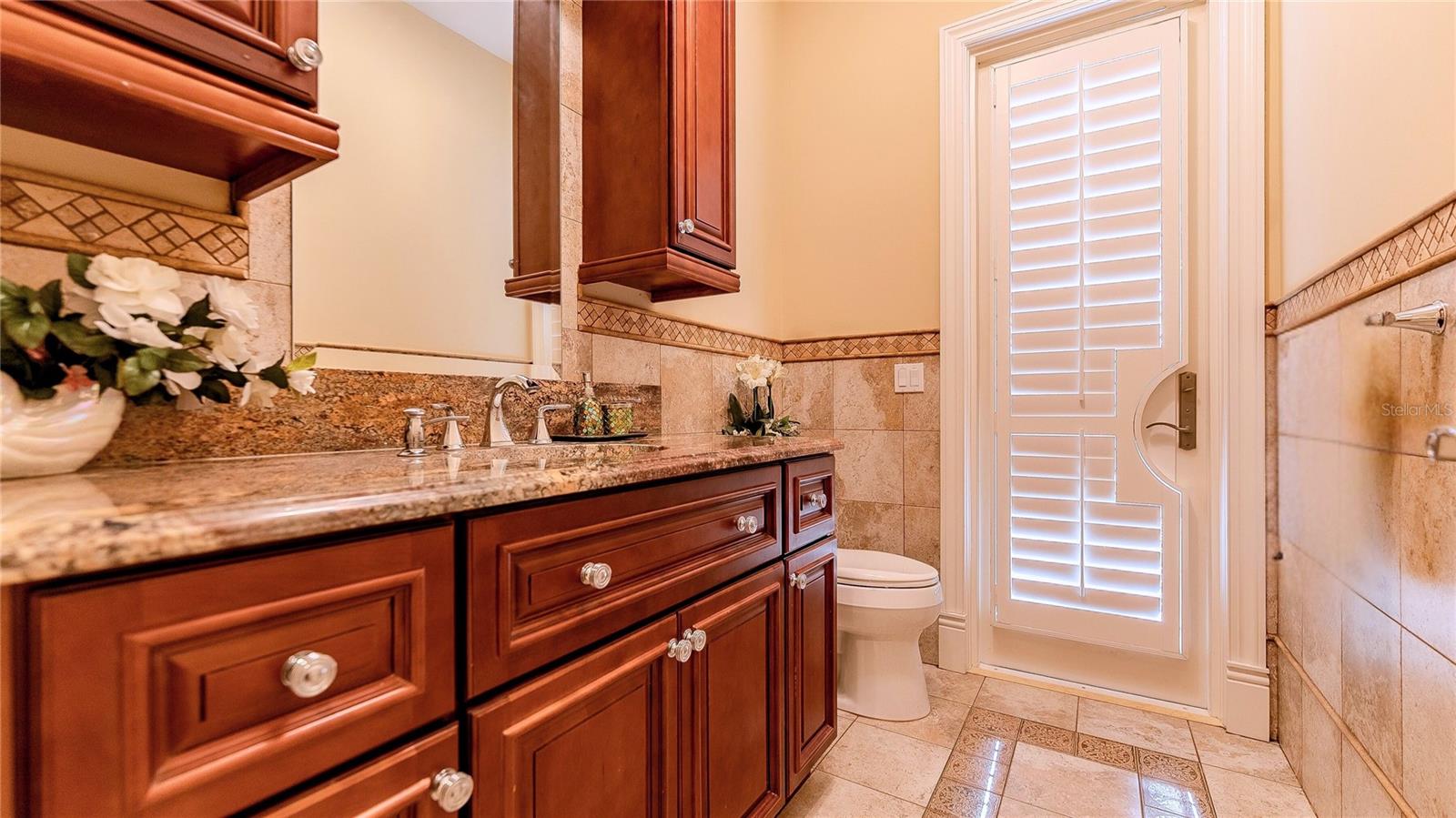 Convenient pool bath designed for seamless indoor-outdoor living.