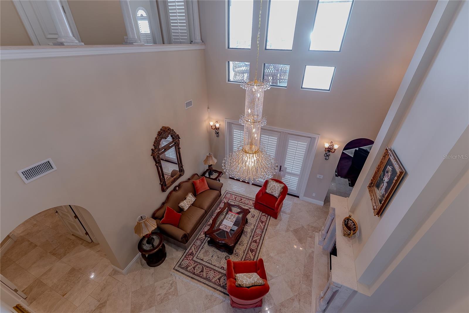 Upper-level vantage point highlighting the grand scale of the main living area.