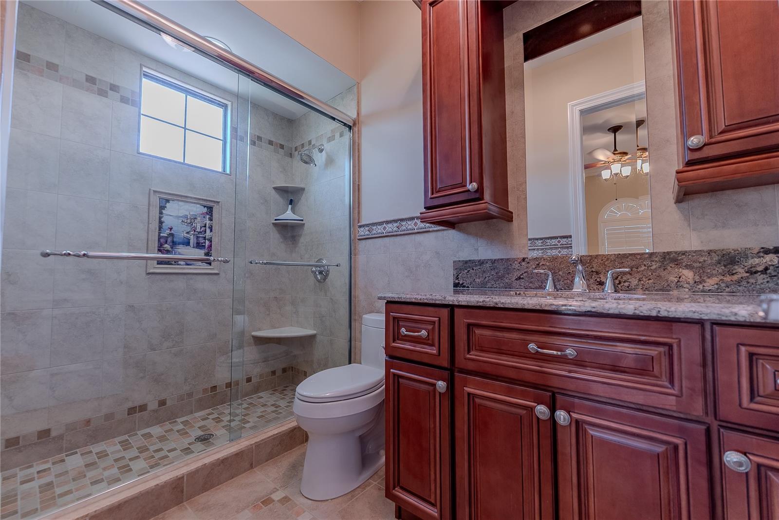 Private en-suite bath serving the upstairs bedroom suite.