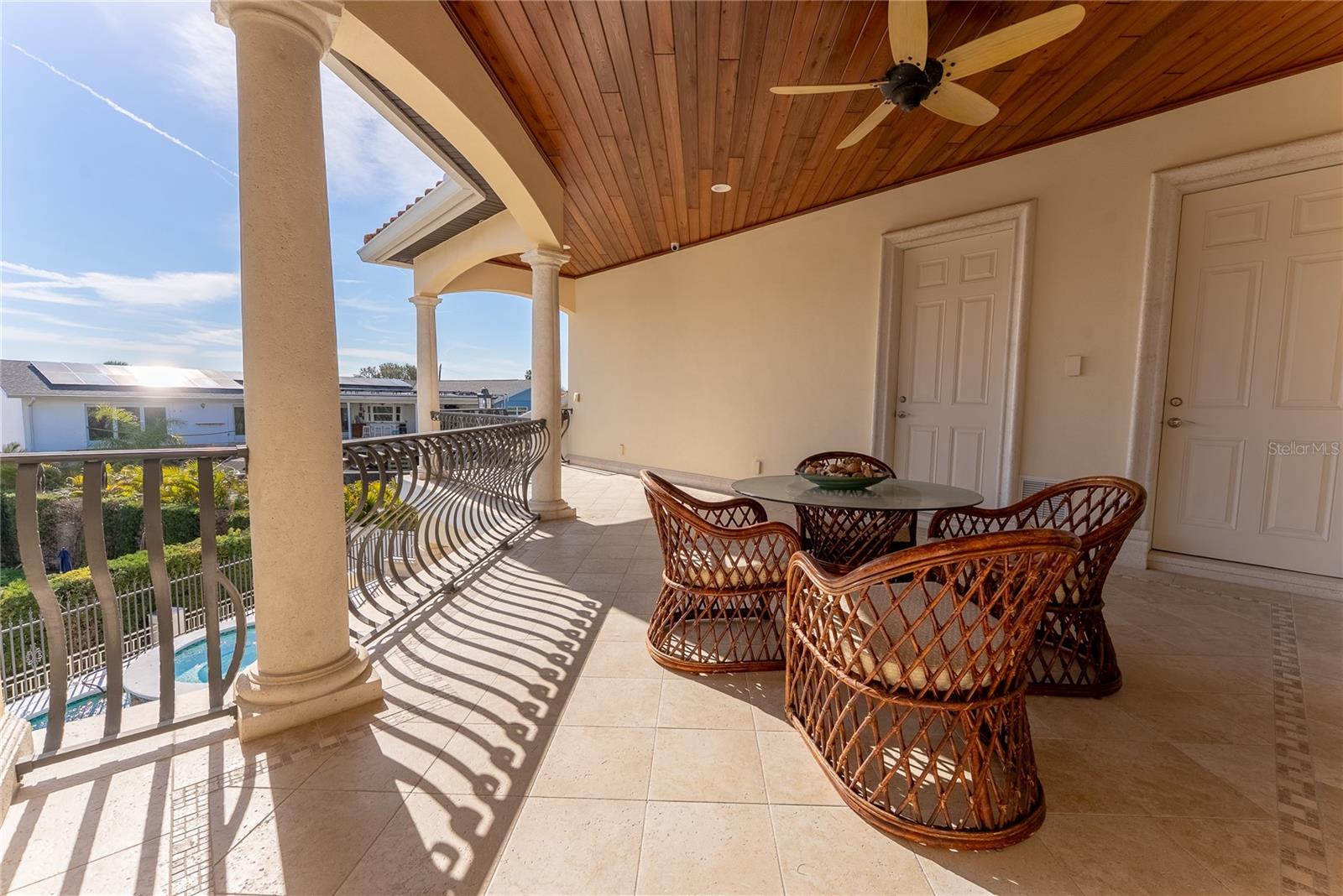 Second-level wraparound terrace designed for outdoor living.