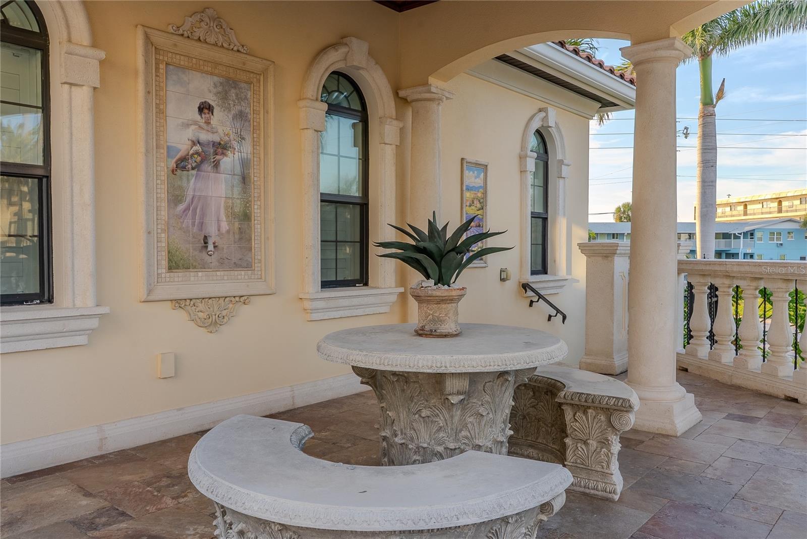 European-inspired architectural details with decorative tile inlays.