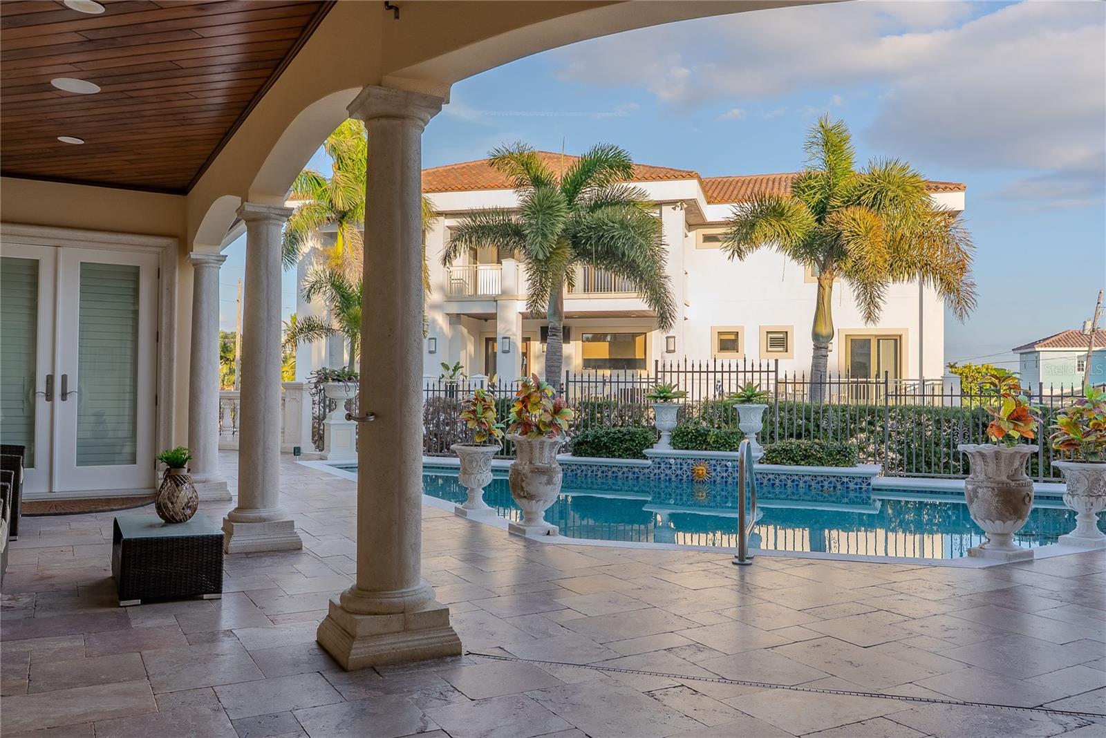Tranquil water feature with custom tile accents and stone detailing.