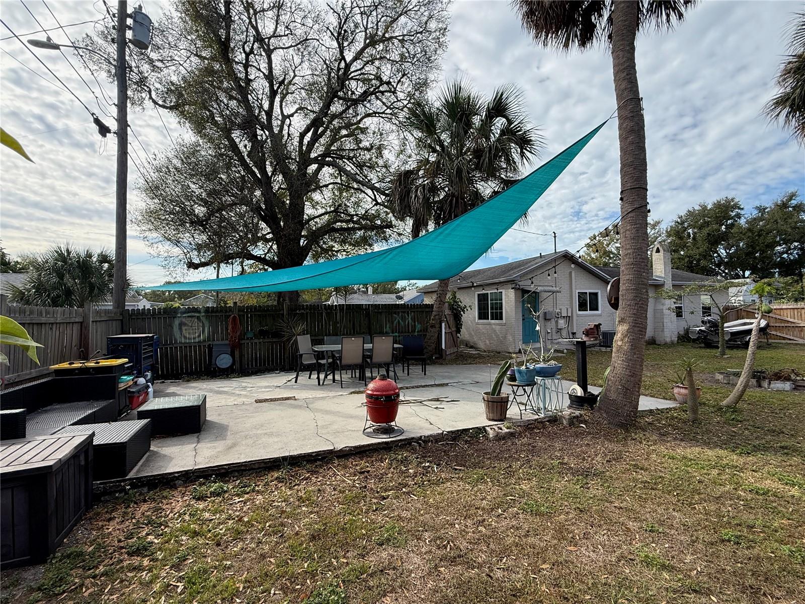 Huge cement patio at the rear of the yard.