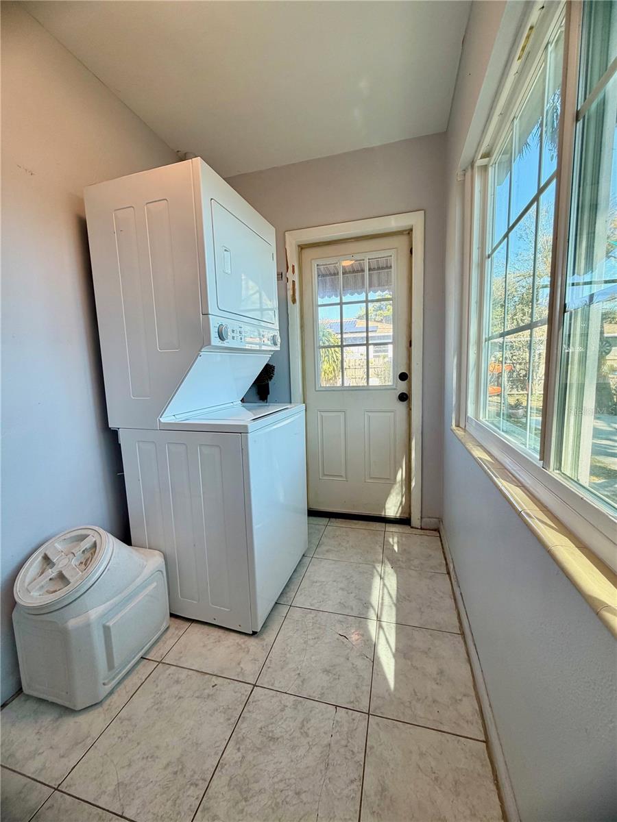 Laundry room with exit to the backyard.