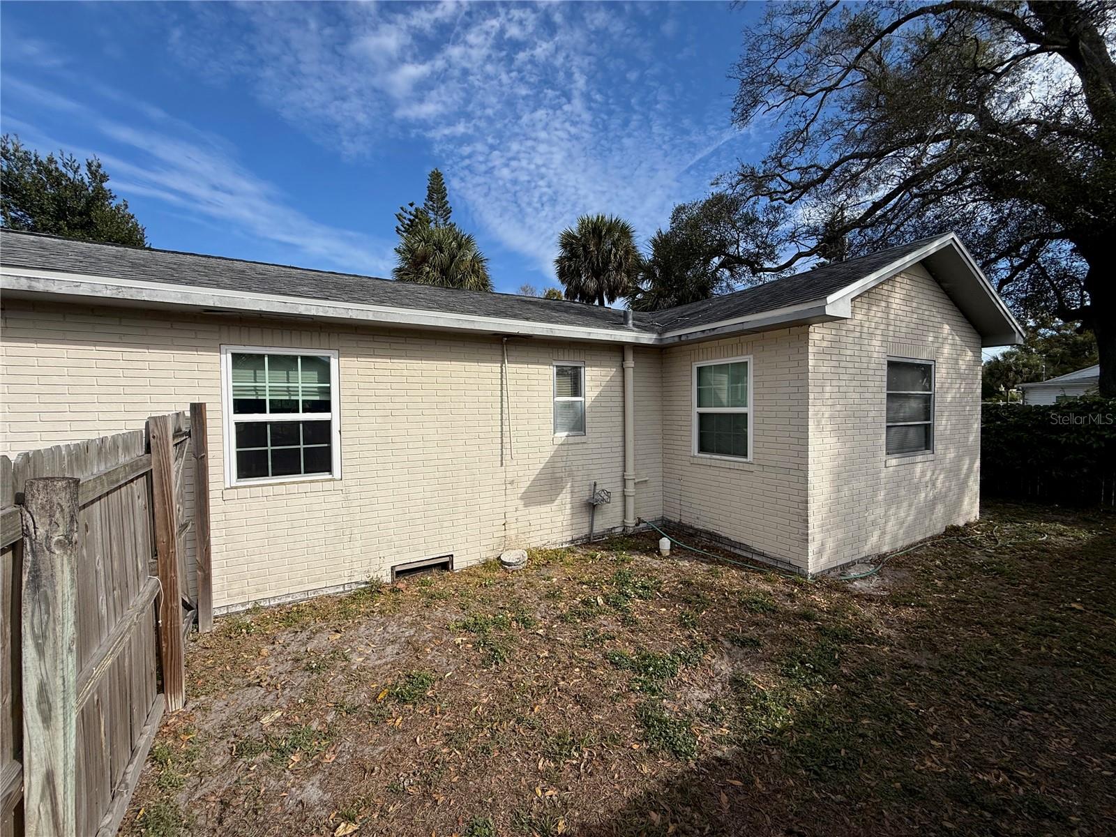 South side of home with brick exterior.