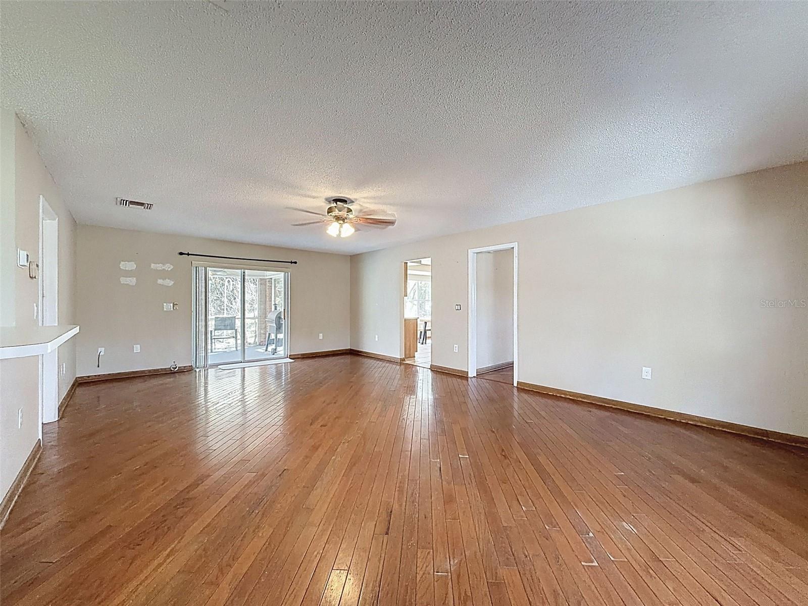 Sliders from Family Room lead out to the patio & pool