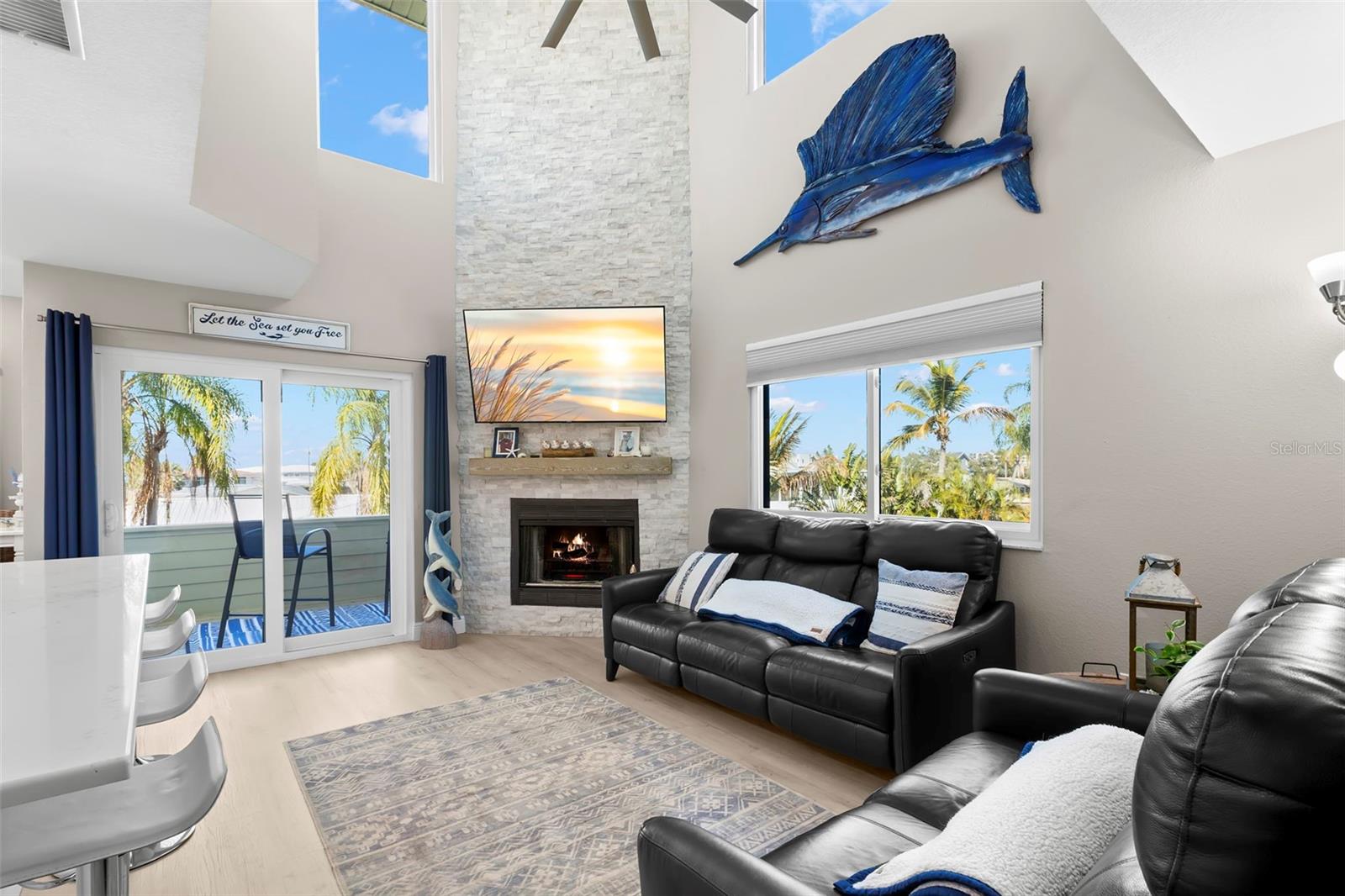 2nd Level-Living room with Vaulted Ceilings, fireplace, and the views!