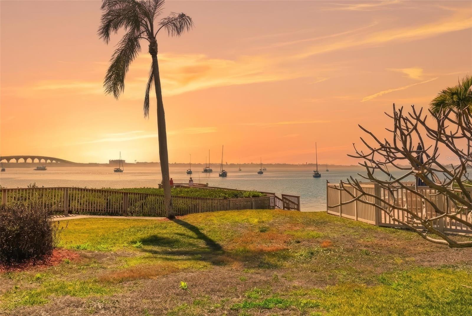 Soak in breathtaking bay views from your living room and screened-in porch as sailboats and dolphins glide gracefully by!