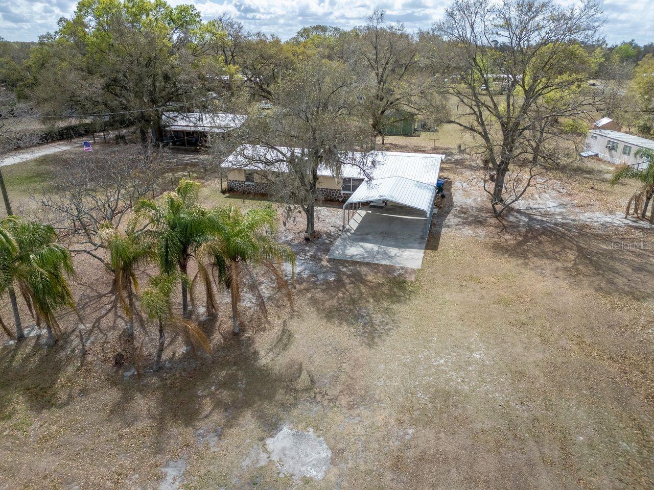 1.19 Acres - 4/2 with a workshop and a shed
