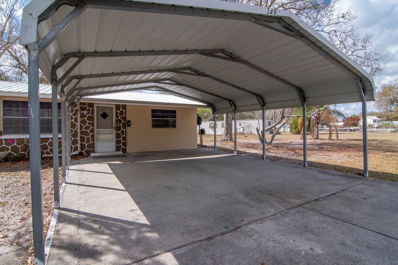 Covered 2-Car Carport with Paved Driveway