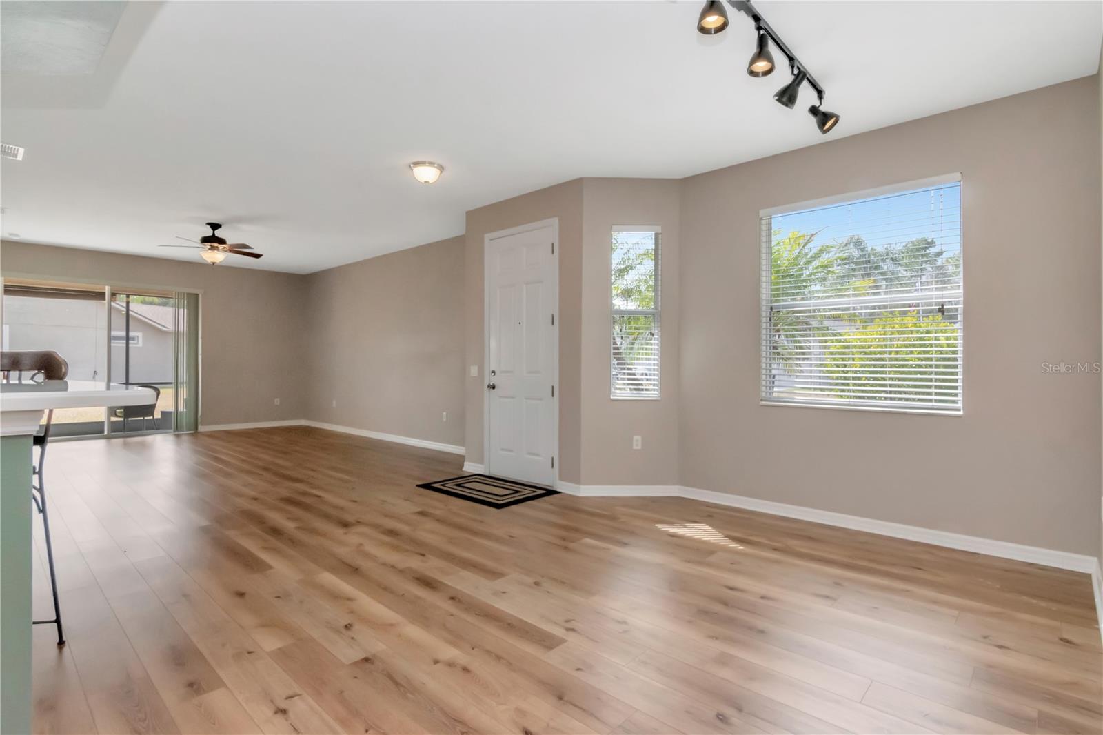 Welcoming entry leading to open living and dining space.