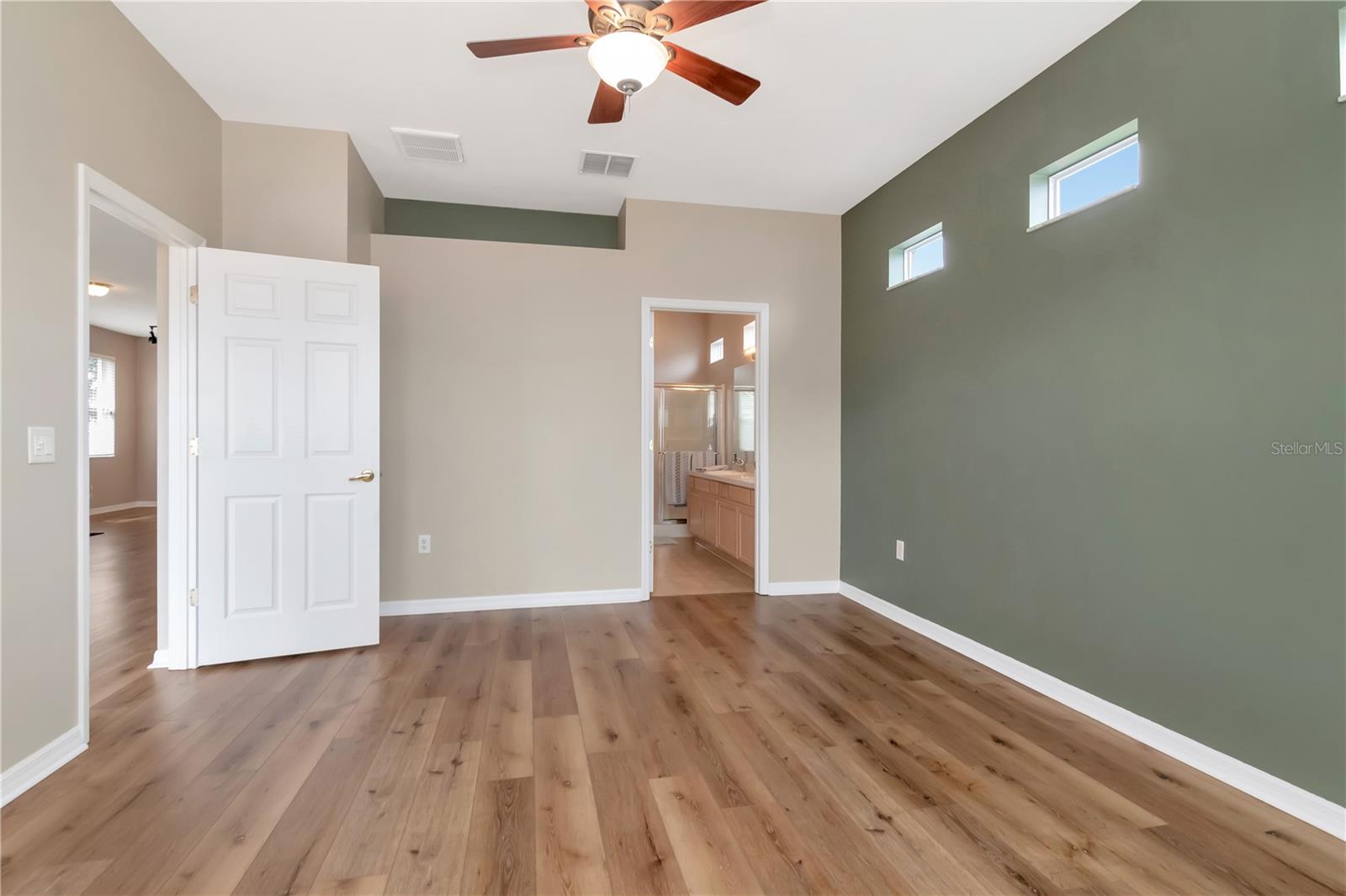 Primary bedroom featuring a private en-suite bath.