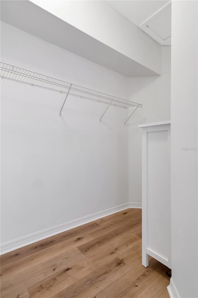 Primary bedroom walk-in closet.