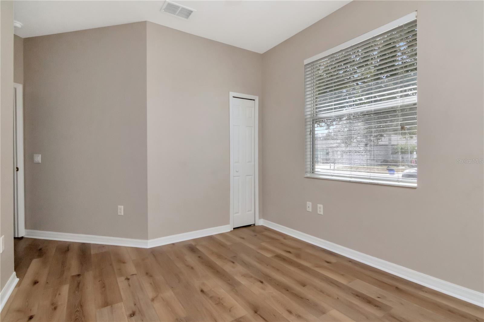 Third bedroom offering flexibility for work, relaxation, or crafting.