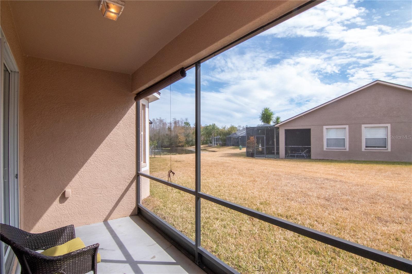 Lanai offering a partial pond view.