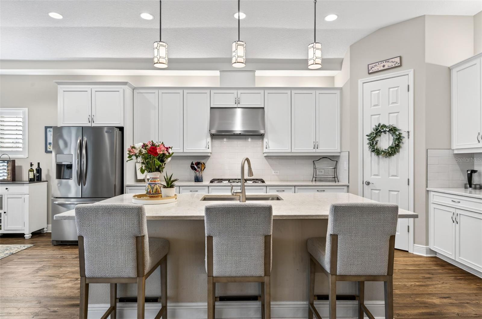 Counter level kitchen island with bar area for dining/socializing