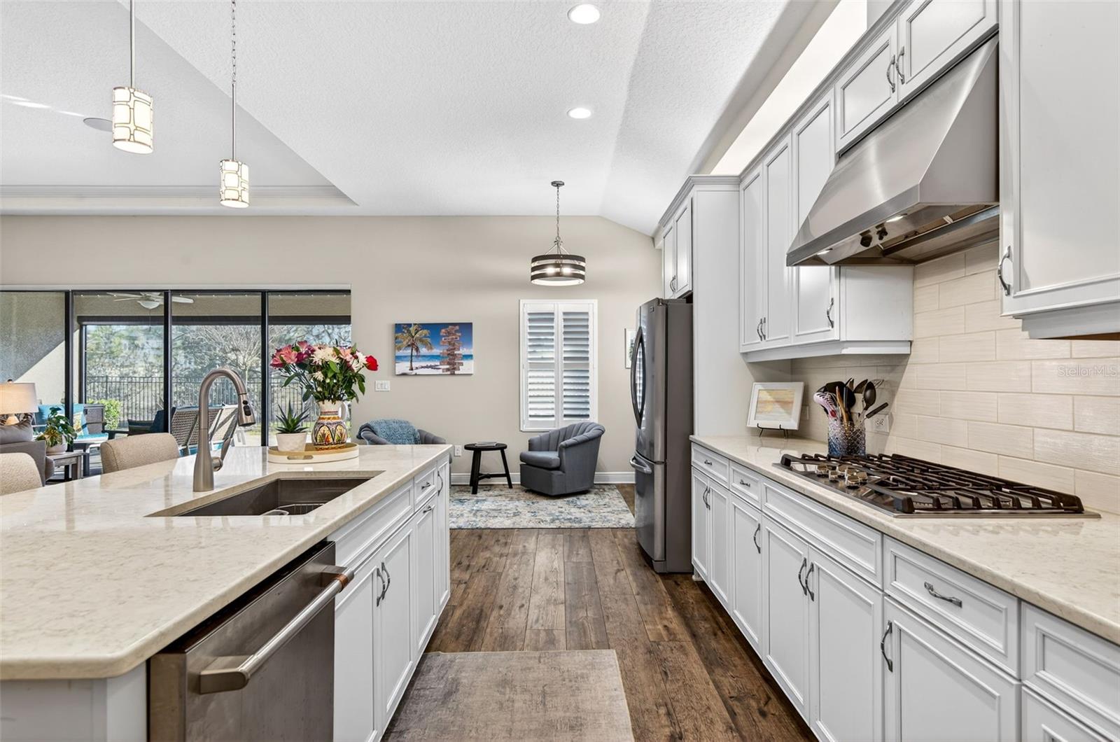 Stainless steel appliances, large single sink, garage for fridge