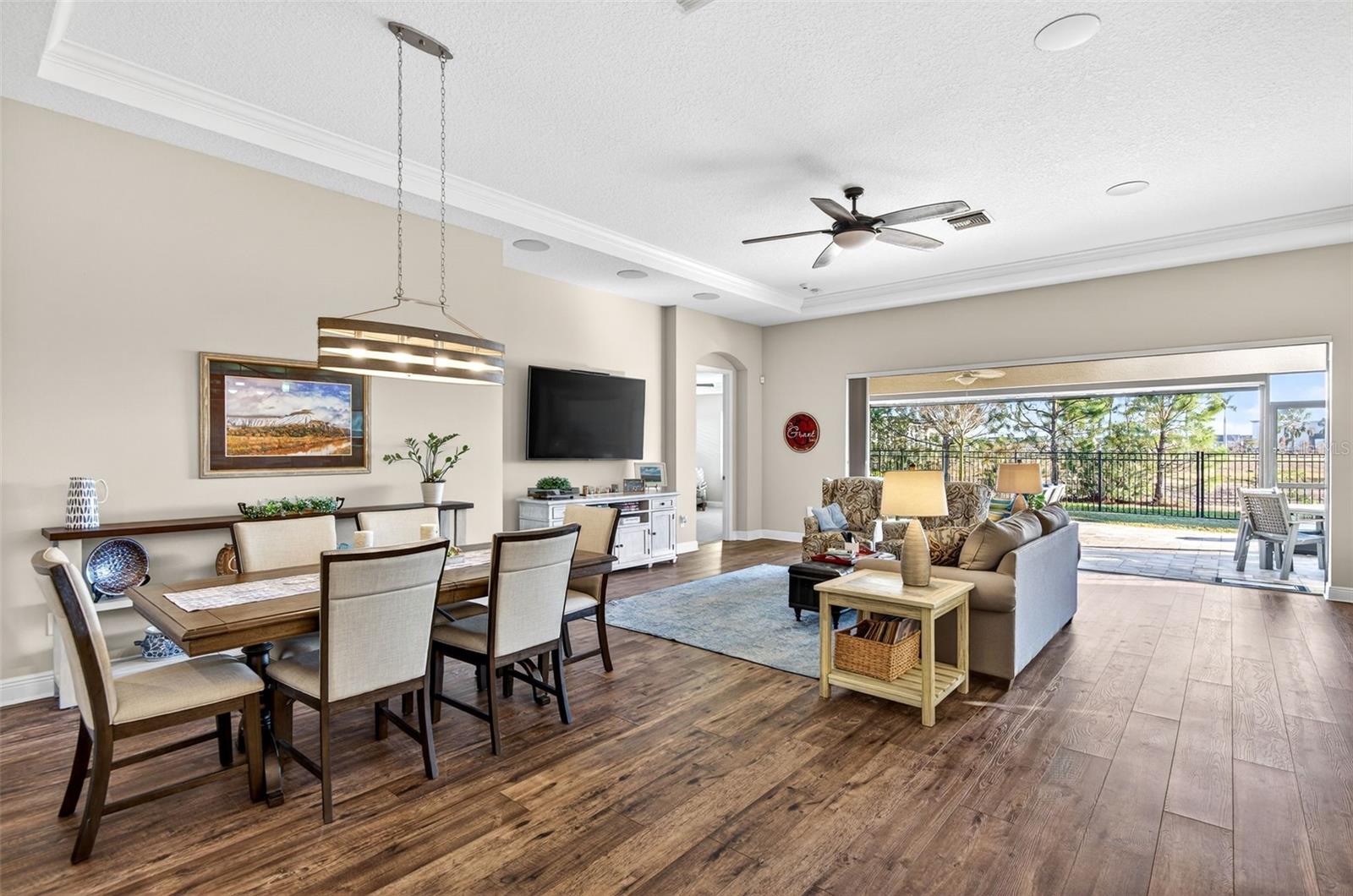 Dining/living area with the sliding glass doors tucked behind the wall for those nice spring days!
