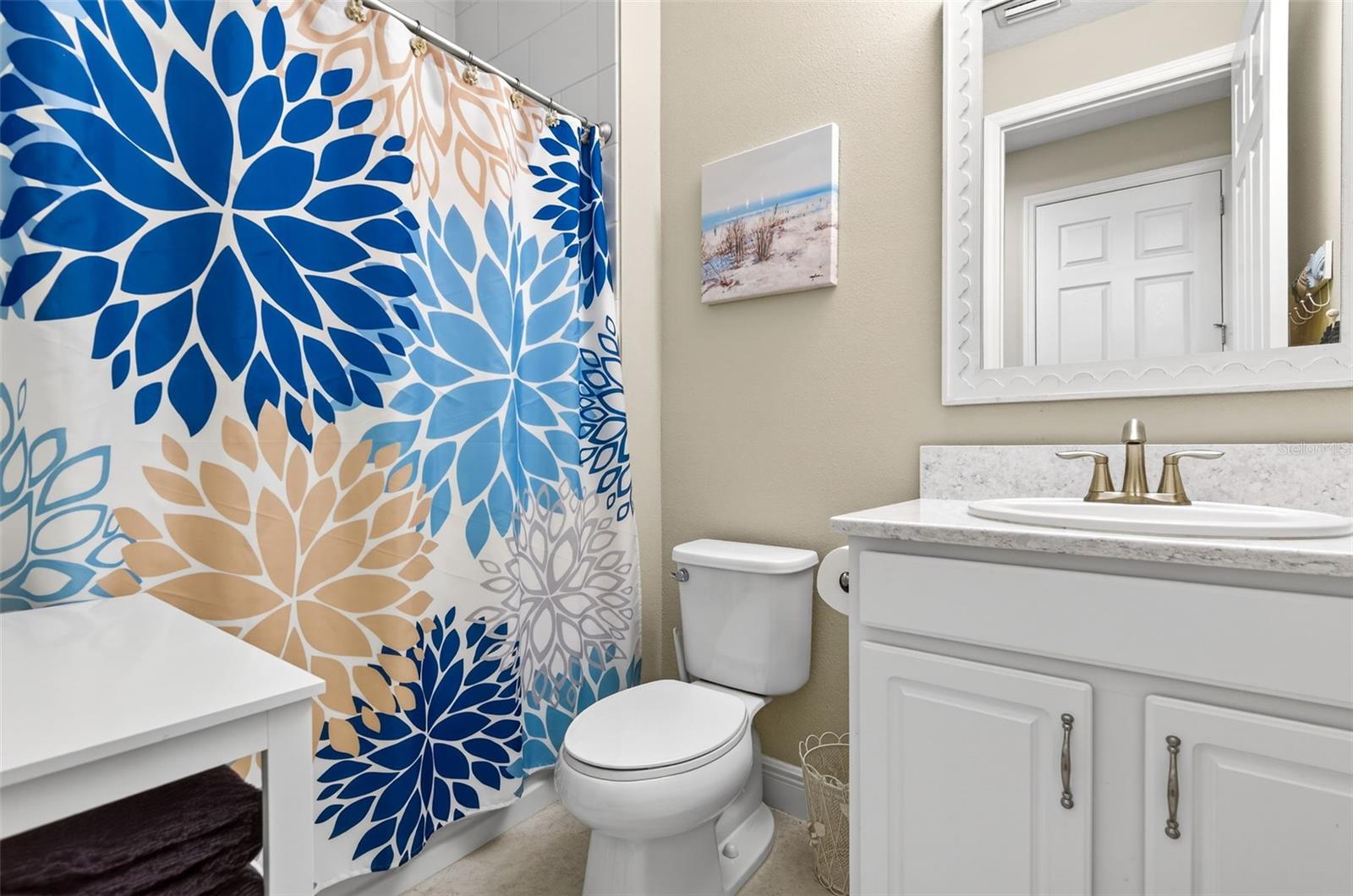 Bathroom #3 with tub/shower combination and comfort height vanity.